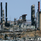 Smokestacks and other structures at an oil refinery.